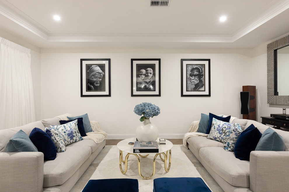 Photo of a transitional enclosed living room in Brisbane with white walls and beige floor.