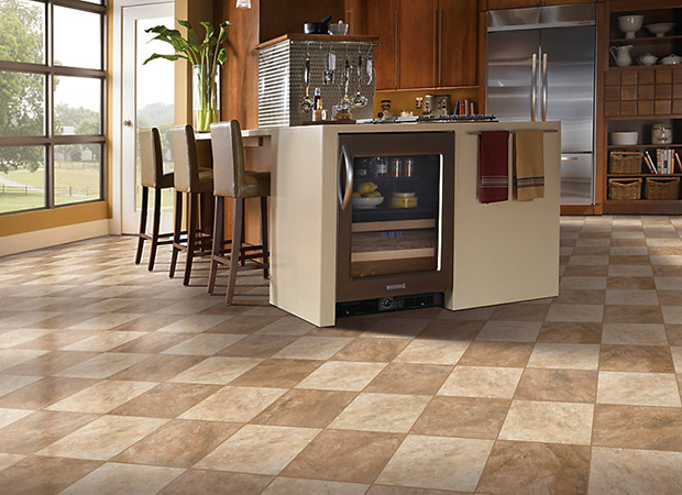 Kitchen - large transitional l-shaped ceramic tile and beige floor kitchen idea in DC Metro with flat-panel cabinets, medium tone wood cabinets, solid surface countertops, stainless steel appliances and an island