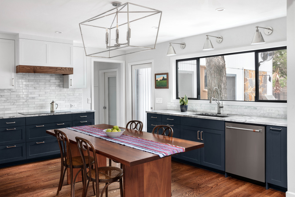 Inspiration for a mid-sized transitional u-shaped medium tone wood floor and brown floor kitchen remodel in Austin with a single-bowl sink, shaker cabinets, blue cabinets, quartzite countertops, gray backsplash, marble backsplash, stainless steel appliances, no island and gray countertops