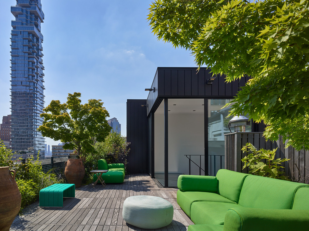 This is an example of a mid-sized contemporary rooftop and rooftop deck in New York with no cover.