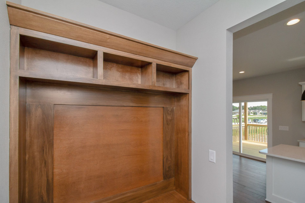 Small transitional ceramic tile and gray floor mudroom photo with gray walls