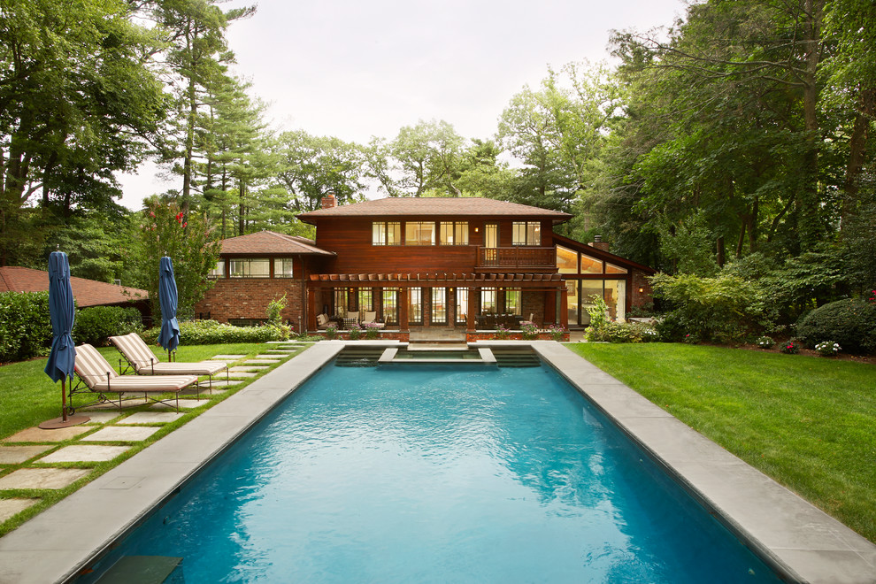 Design ideas for an expansive arts and crafts backyard rectangular lap pool in New York with a hot tub.