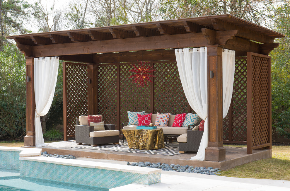 Mid-sized contemporary backyard patio in Houston with a gazebo/cabana and stamped concrete.