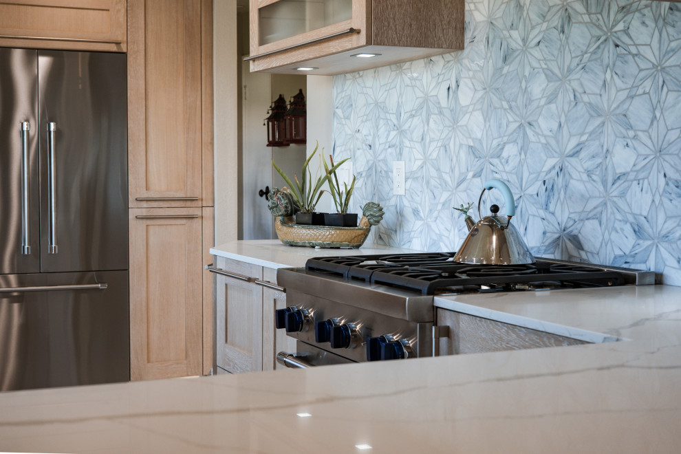 Example of a small transitional u-shaped ceramic tile and beige floor open concept kitchen design in San Francisco with a double-bowl sink, recessed-panel cabinets, light wood cabinets, quartz countertops, white backsplash, quartz backsplash, stainless steel appliances and white countertops