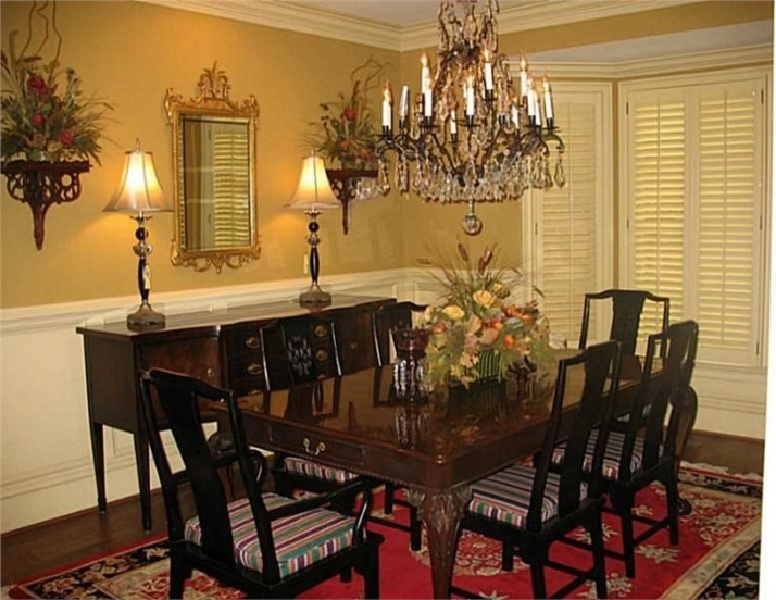 Design ideas for a mid-sized traditional separate dining room in Atlanta with white walls and dark hardwood floors.