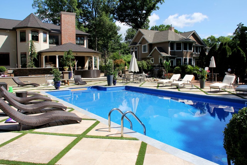Pool - large backyard stone and rectangular lap pool idea in New York