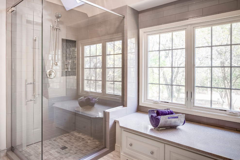 Mid-sized transitional master bathroom in Kansas City with raised-panel cabinets, white cabinets, a two-piece toilet, multi-coloured tile, mosaic tile, purple walls, porcelain floors, an undermount sink, engineered quartz benchtops and a corner shower.