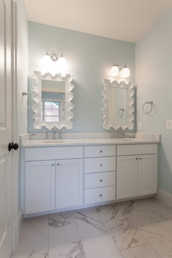 Home design - transitional kids' white tile and subway tile gray floor home design idea in DC Metro with recessed-panel cabinets, white cabinets, blue walls, an undermount sink, a hinged shower door and gray countertops