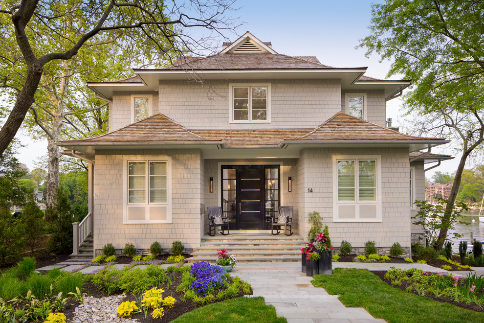 Design ideas for a transitional two-storey exterior in Baltimore with a hip roof.