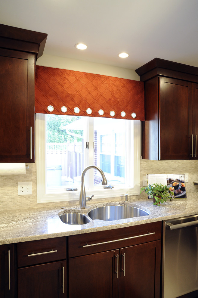 Eat-in kitchen - large transitional u-shaped ceramic tile and beige floor eat-in kitchen idea with a double-bowl sink, shaker cabinets, dark wood cabinets, granite countertops, beige backsplash, mosaic tile backsplash, stainless steel appliances and a peninsula