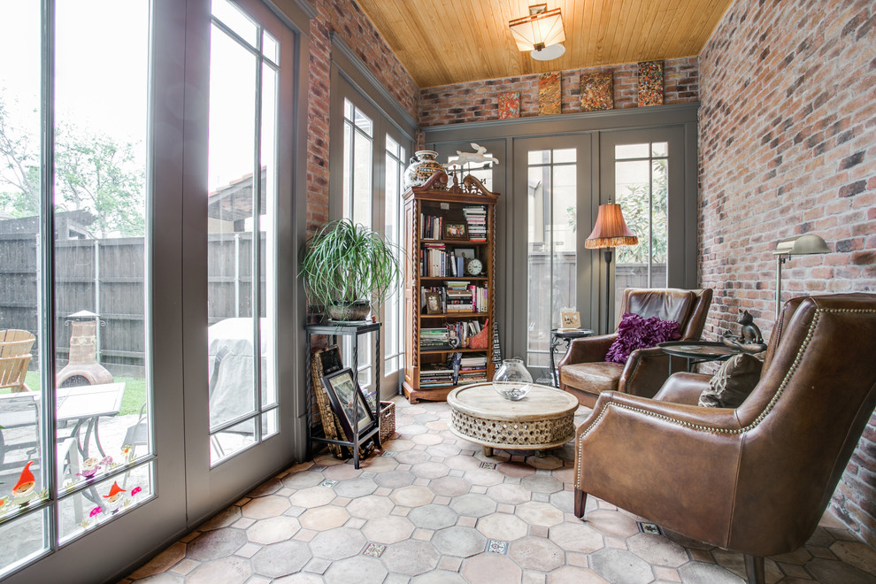 Photo of a mid-sized arts and crafts sunroom in Dallas with no fireplace, a standard ceiling, beige floor and concrete floors.