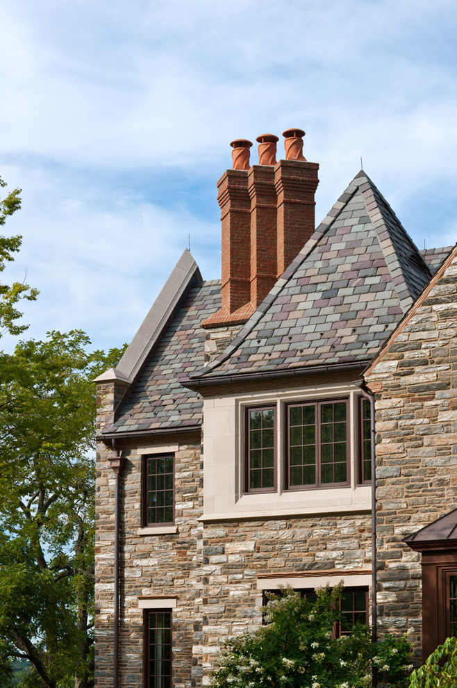 Design ideas for an expansive traditional grey exterior in Philadelphia with stone veneer.