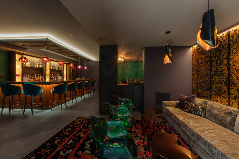 Seated home bar - huge contemporary l-shaped gray floor seated home bar idea in Other