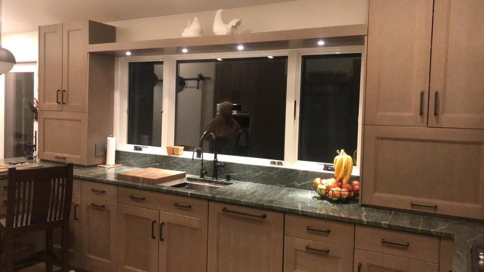 Example of a transitional home design design in Boston