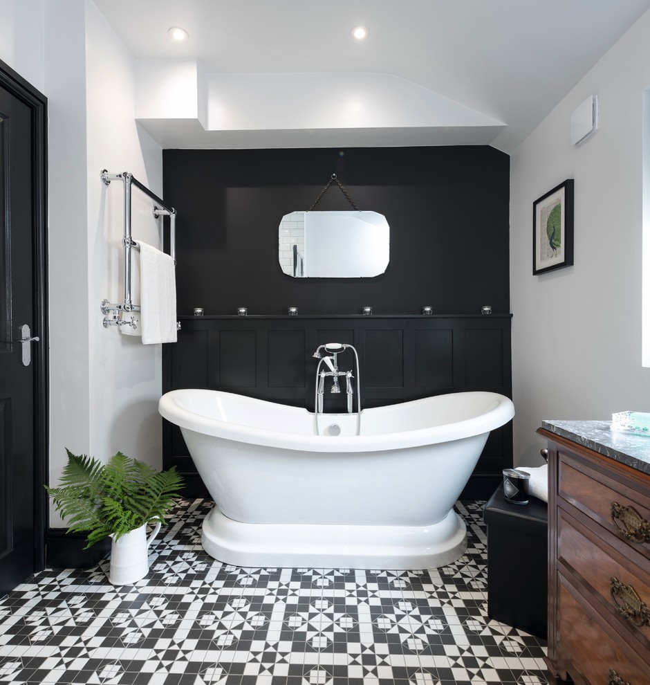 Mid-sized traditional kids bathroom in Other with dark wood cabinets, a freestanding tub, an open shower, a two-piece toilet, black and white tile, ceramic tile, grey walls, ceramic floors, a vessel sink and marble benchtops.
