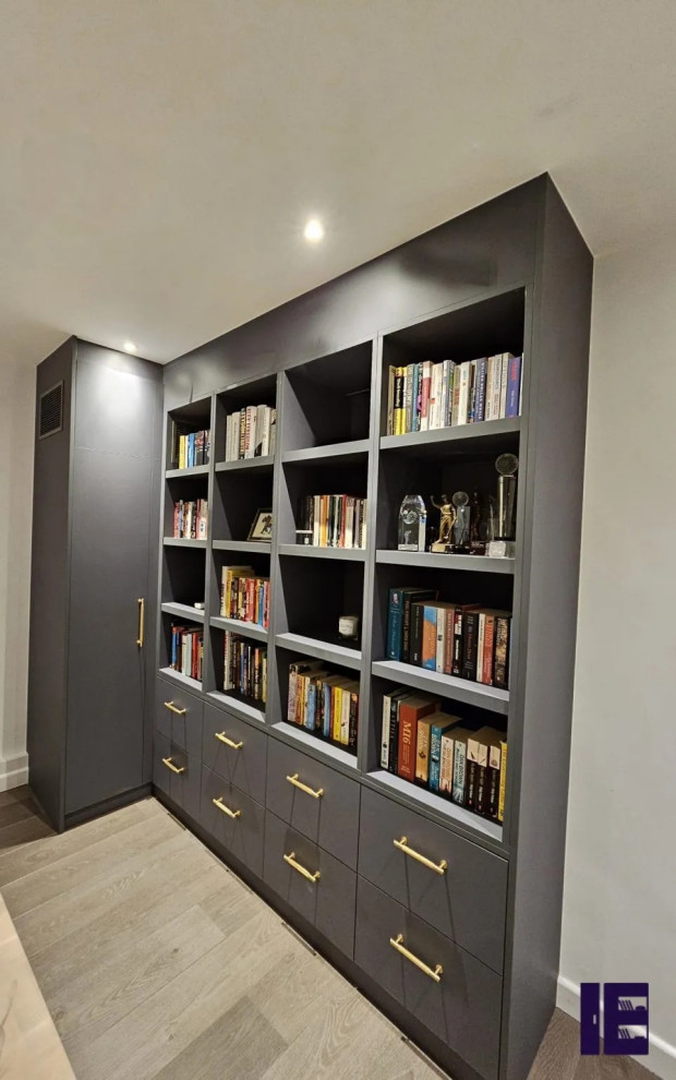 Large modern open plan games room in London with a reading nook and feature lighting.