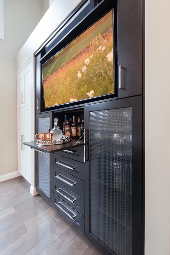Design ideas for a small transitional home bar in Boston with black cabinets, porcelain floors and shaker cabinets.