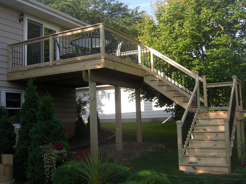 Inspiration for a mid-sized backyard balcony deck remodel with no cover
