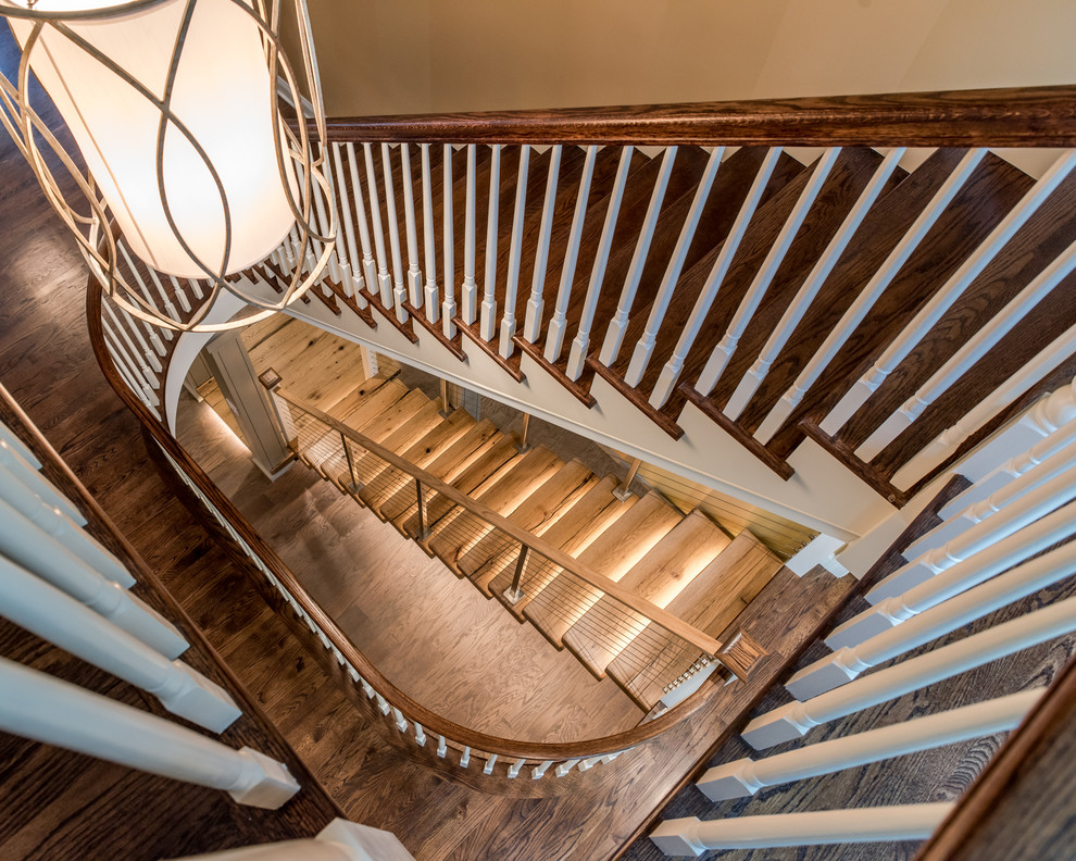 Expansive contemporary wood straight staircase in Philadelphia with concrete risers.