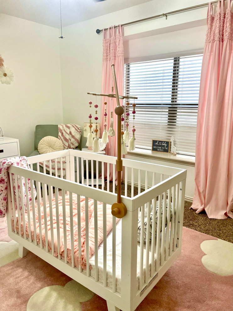 Inspiration for a large transitional nursery for girls in Dallas with beige walls and carpet.
