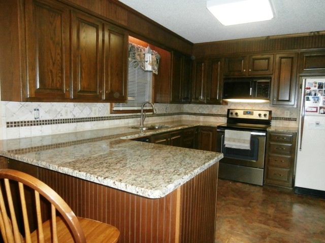 st. cecilia granite on dark cabinets - traditional - kitchen