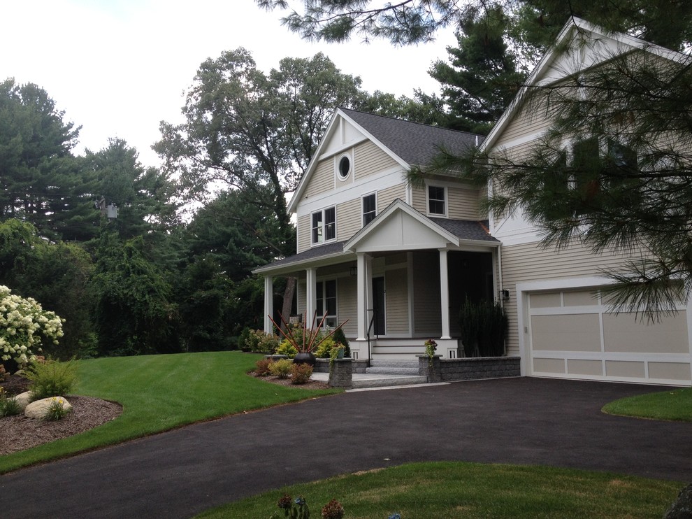 Inspiration for a large transitional beige two-story mixed siding gable roof remodel in Boston with a shingle roof