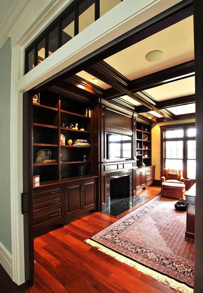 Inspiration for a large traditional study room in Boston with white walls, medium hardwood floors, a standard fireplace, a stone fireplace surround, a freestanding desk and brown floor.