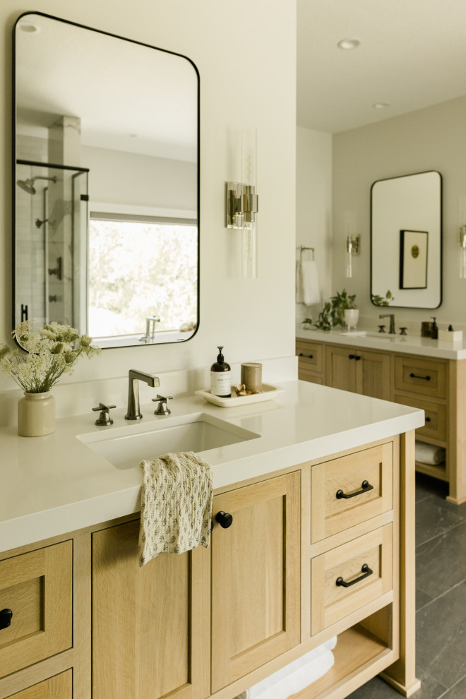 Inspiration for a mid-sized transitional master white tile and ceramic tile ceramic tile, black floor and double-sink freestanding bathtub remodel with recessed-panel cabinets, light wood cabinets, gray walls, an undermount sink, quartz countertops, a hinged shower door, white countertops and a built-in vanity
