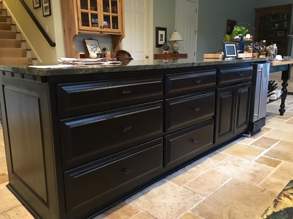 This is an example of a small modern u-shaped eat-in kitchen in Atlanta with raised-panel cabinets, black cabinets, granite benchtops, stainless steel appliances, terra-cotta floors, with island, black splashback, ceramic splashback, beige floor, green benchtop and vaulted.