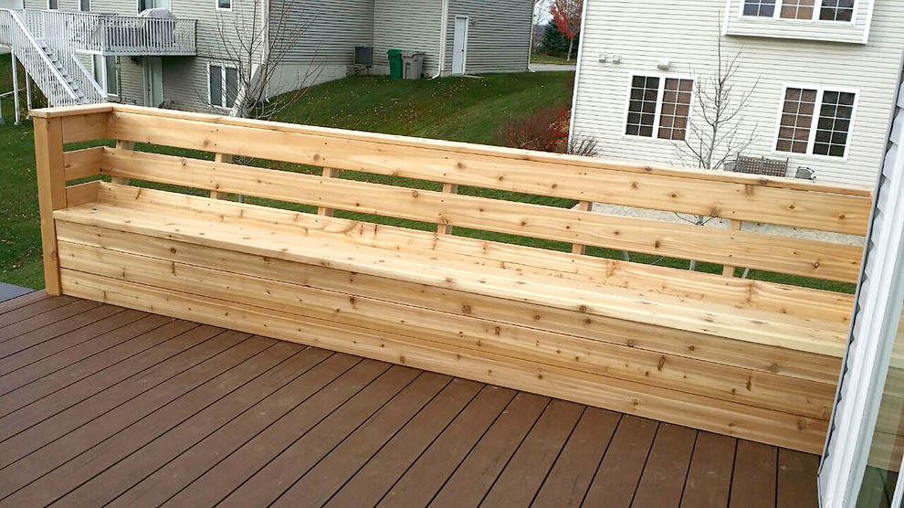 Example of a mid-sized classic backyard deck design with no cover