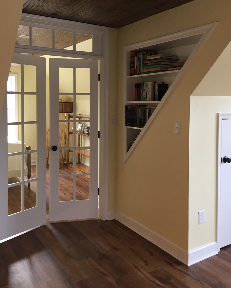 Inspiration for a large timeless loft-style vinyl floor home design remodel with yellow walls