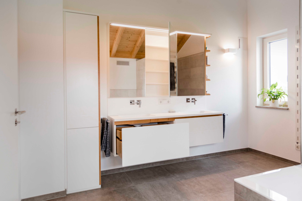 Mid-sized contemporary master bathroom in Munich with white cabinets, a drop-in sink, solid surface benchtops, white benchtops, a double vanity and a built-in vanity.