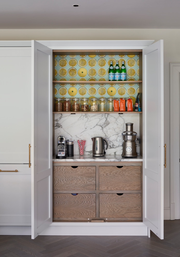 Design ideas for a large traditional galley home bar in Hampshire with a built-in sink, shaker cabinets, grey cabinets, marble worktops, white splashback, marble splashback, light hardwood flooring, beige floors and white worktops.