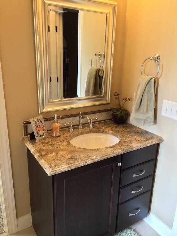 Small transitional 3/4 beige tile and ceramic tile bathroom photo in Raleigh with an undermount sink and granite countertops