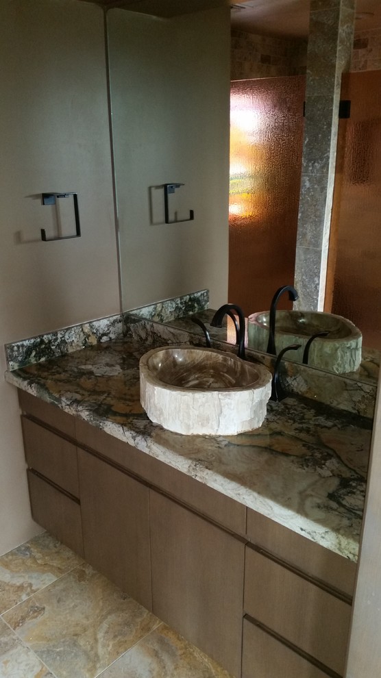 Bathroom - mid-sized rustic ceramic tile bathroom idea in Phoenix with flat-panel cabinets, medium tone wood cabinets, brown walls, a vessel sink and granite countertops
