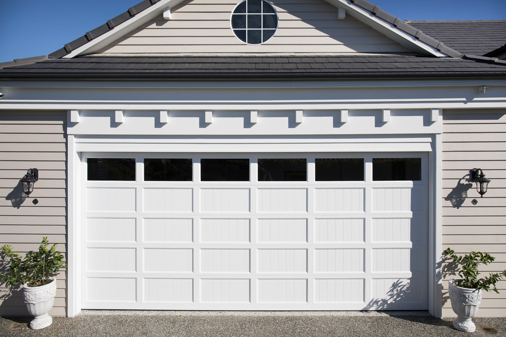 Photo of a beach style garage in Brisbane.