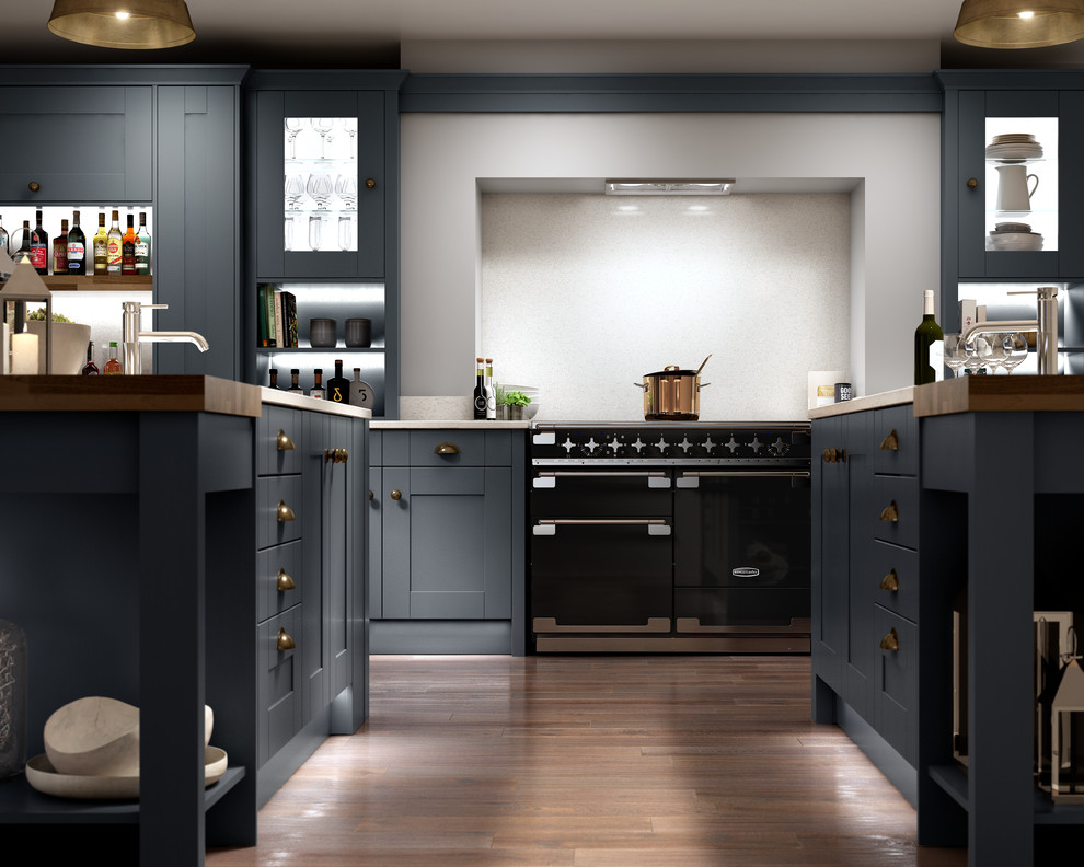 This is an example of a large country single-wall open plan kitchen in Other with a drop-in sink, shaker cabinets, blue cabinets, quartzite benchtops, white splashback, black appliances, dark hardwood floors, multiple islands and brown floor.