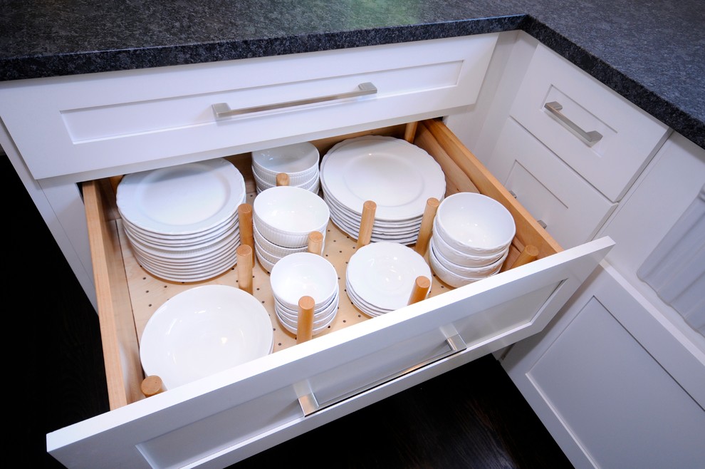 Example of a mid-sized transitional galley dark wood floor eat-in kitchen design in DC Metro with a farmhouse sink, shaker cabinets, white cabinets, granite countertops, white backsplash, subway tile backsplash, stainless steel appliances and a peninsula