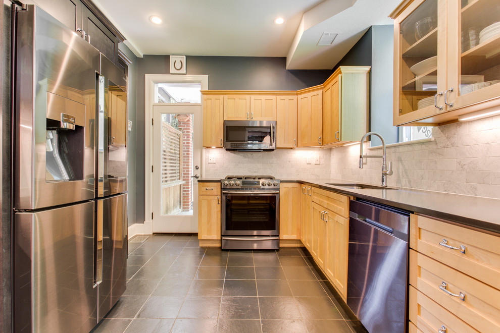 Inspiration for a mid-sized transitional kitchen remodel in DC Metro with recessed-panel cabinets, quartz countertops, stainless steel appliances and a peninsula