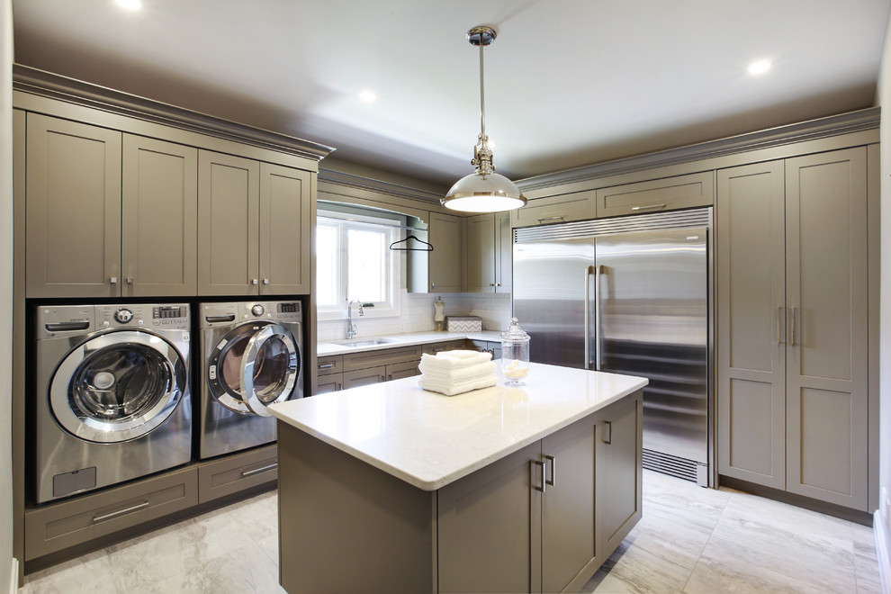 Design ideas for a transitional l-shaped utility room in Toronto with an undermount sink, shaker cabinets, beige walls, a side-by-side washer and dryer, white floor and grey cabinets.