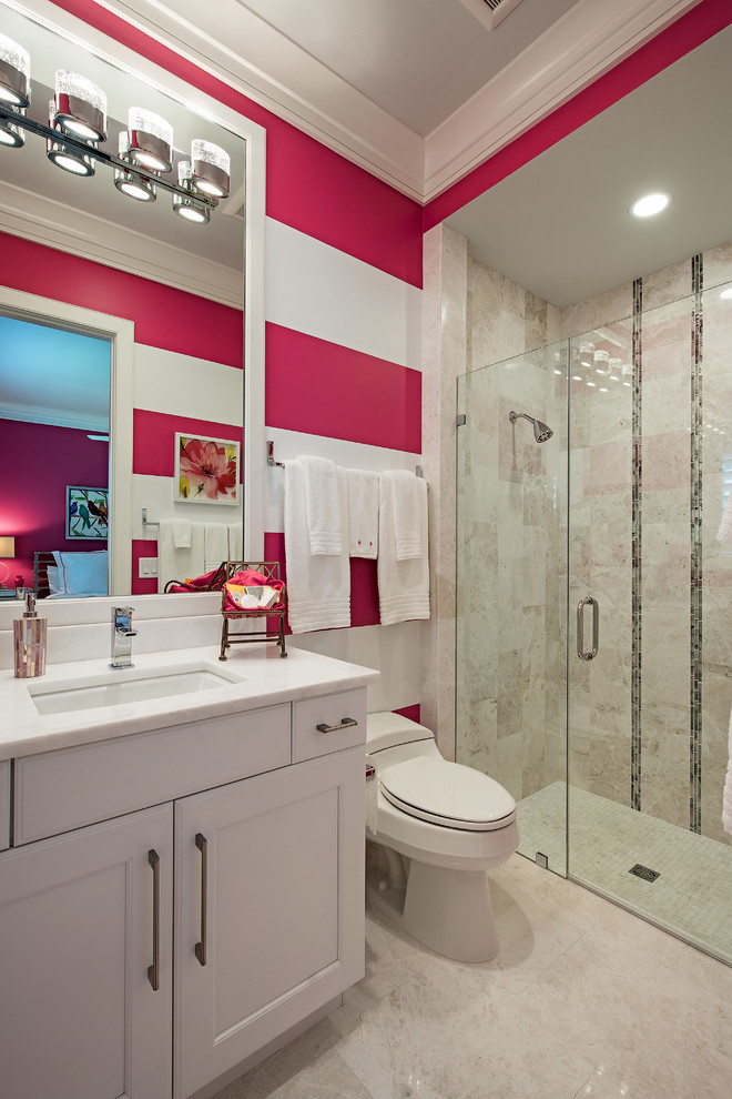 Inspiration for a transitional beige tile walk-in shower remodel with recessed-panel cabinets, white cabinets, a one-piece toilet, multicolored walls, an undermount sink and a hinged shower door