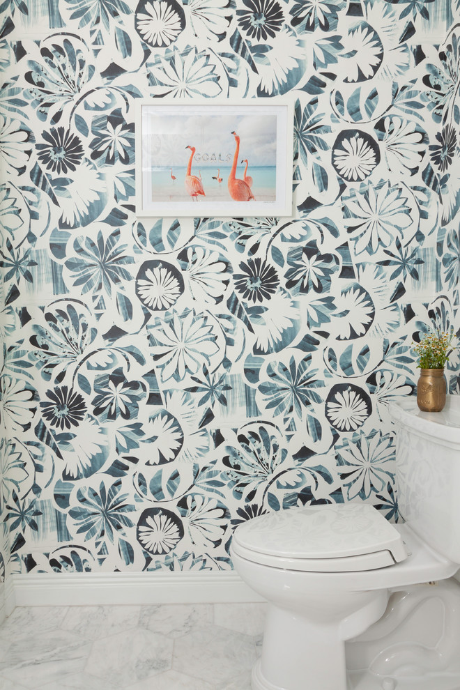 Design ideas for a kids bathroom in New York with wallpaper, a one-piece toilet, blue walls, marble floors and white floor.