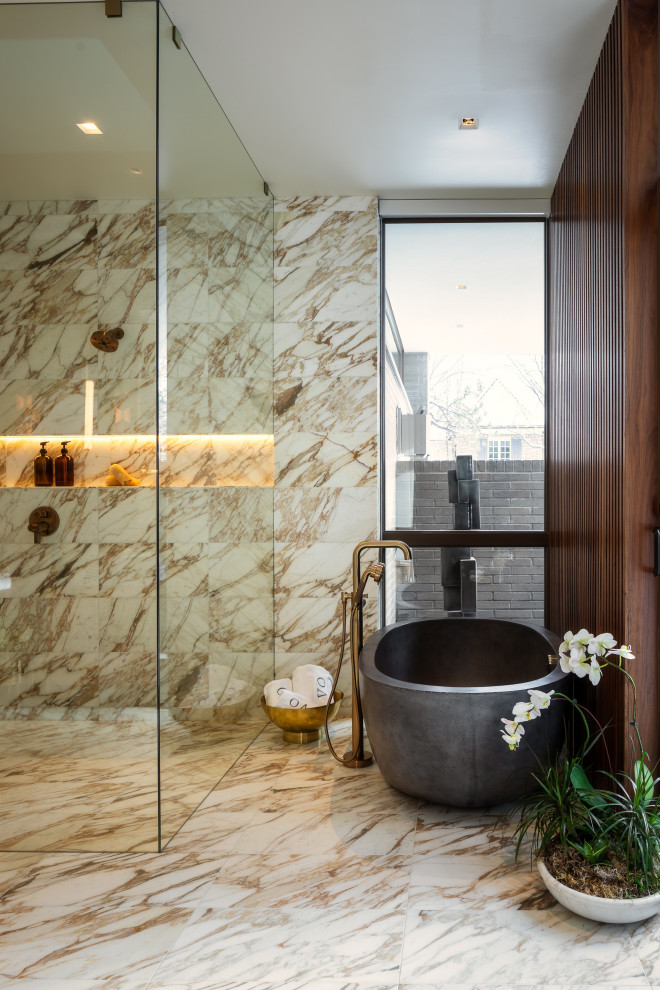 Bathroom - mid-sized contemporary brown tile and marble tile marble floor, multicolored floor and wood wall bathroom idea in Denver with a one-piece toilet, multicolored walls, an integrated sink, marble countertops and black countertops