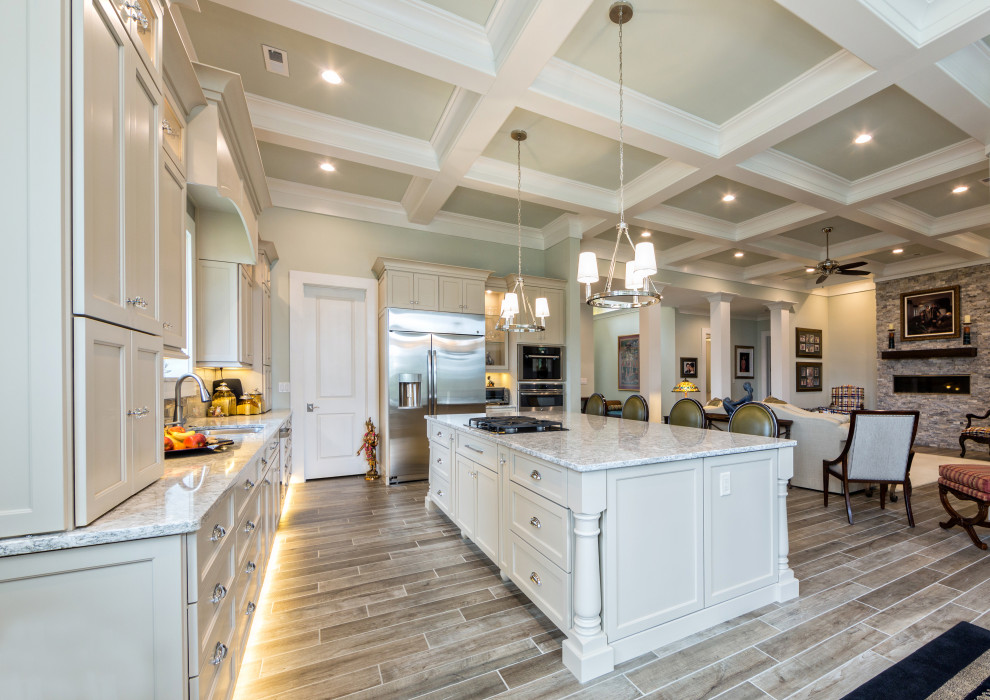 Design ideas for an expansive transitional l-shaped kitchen in Other with an undermount sink, shaker cabinets, white cabinets, stainless steel appliances, with island, grey floor, grey benchtop and coffered.