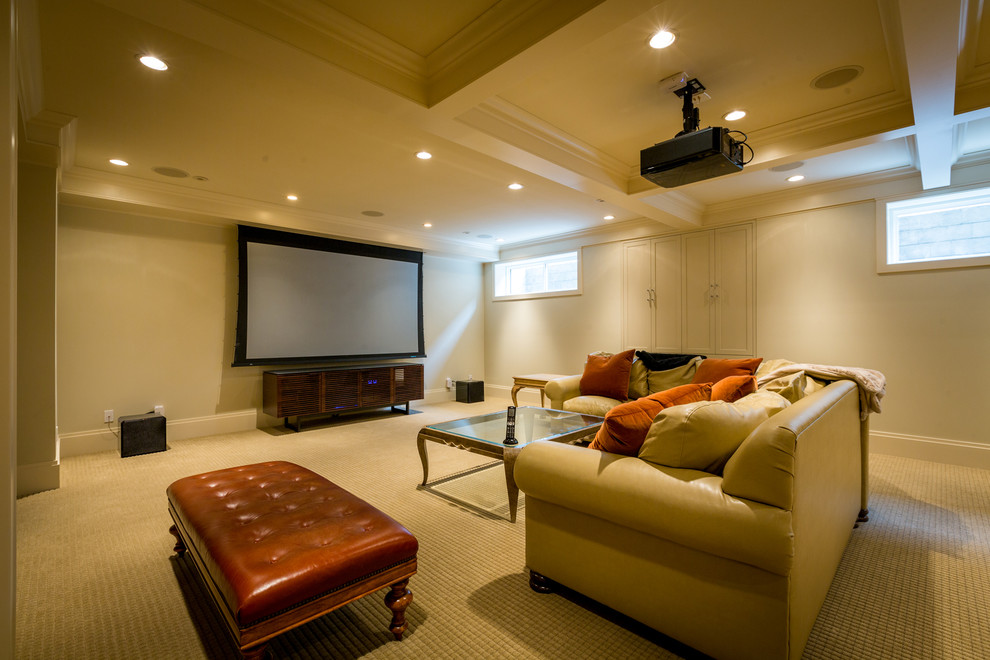 Inspiration for a large modern open concept home theatre in Calgary with beige walls, carpet, a projector screen and beige floor.