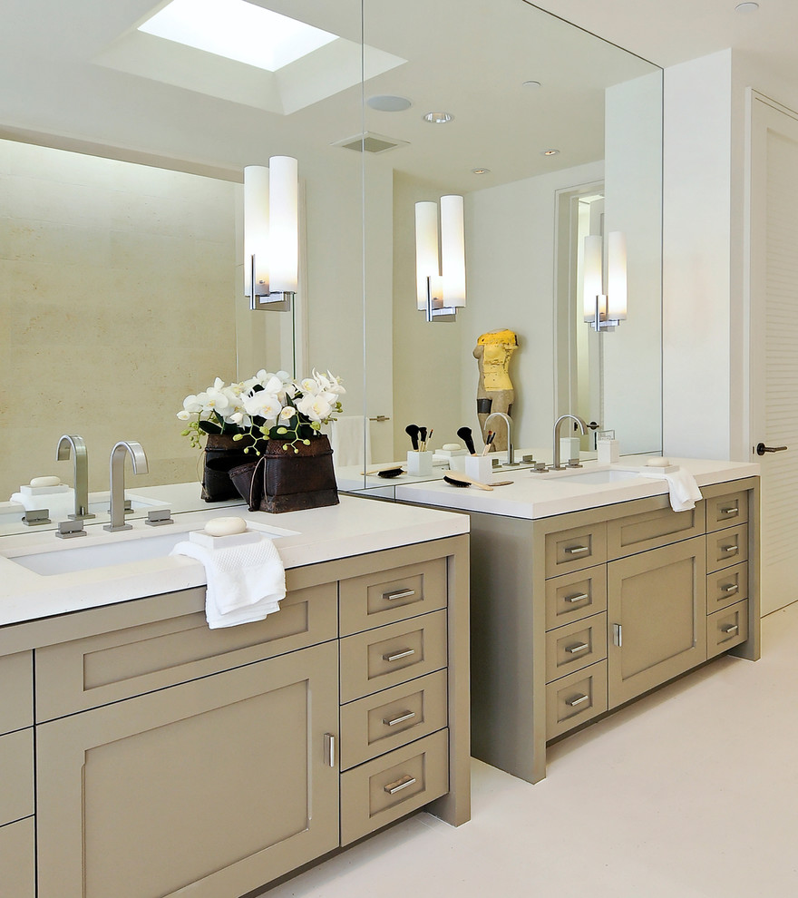 Photo of a contemporary bathroom in San Francisco with shaker cabinets and white benchtops.