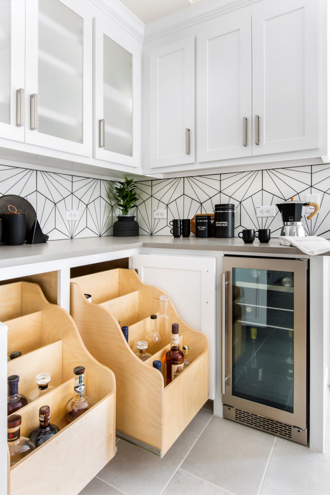 Enclosed kitchen - mid-sized modern ceramic tile and gray floor enclosed kitchen idea in Dallas with a farmhouse sink, shaker cabinets, white cabinets, quartz countertops, white backsplash, ceramic backsplash, stainless steel appliances, an island and gray countertops