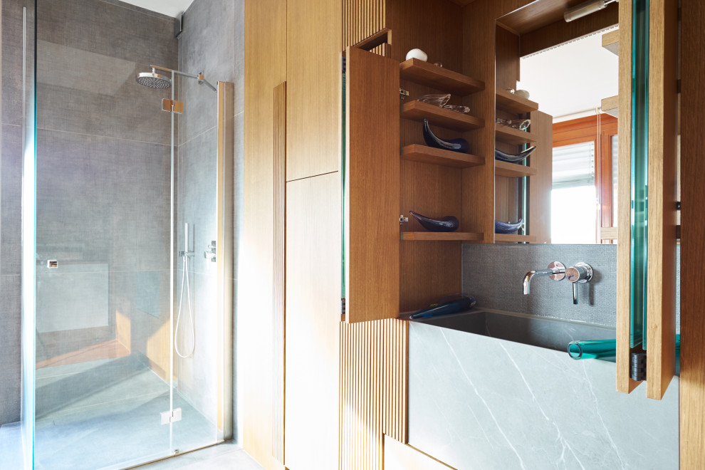 This is an example of a contemporary bathroom in Milan with decorative wall panelling.