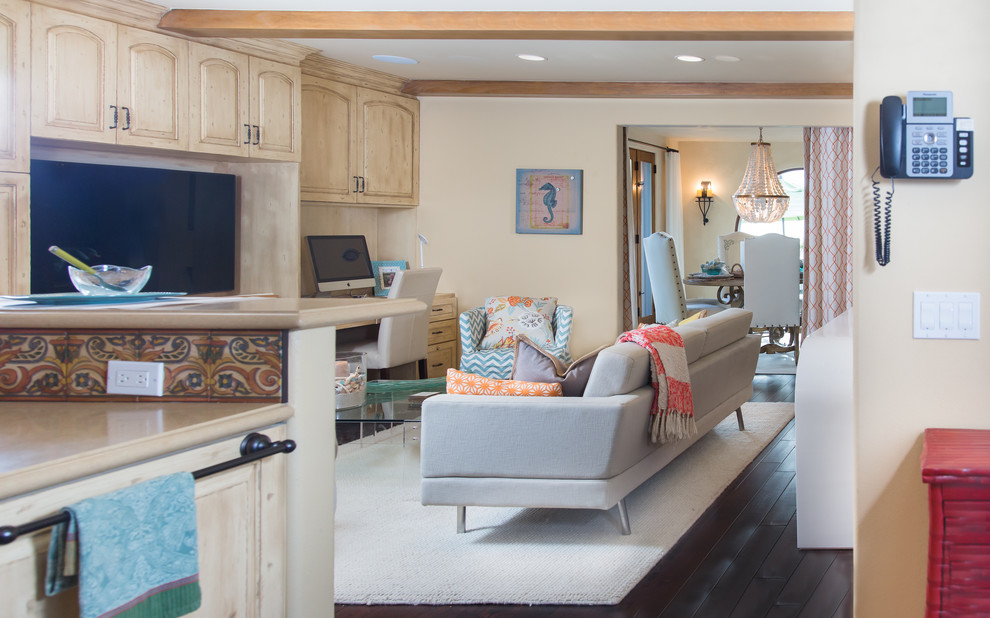 Example of a mid-sized transitional dark wood floor eat-in kitchen design with a drop-in sink, recessed-panel cabinets, light wood cabinets, solid surface countertops, red backsplash, terra-cotta backsplash, stainless steel appliances and an island