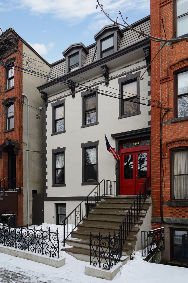 Elegant three-story townhouse exterior photo in New York